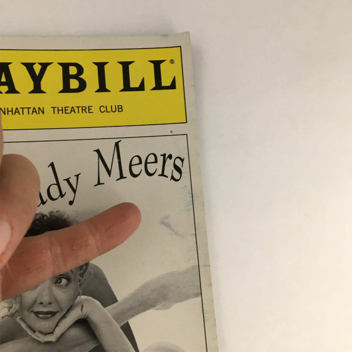 Close-up of the 1999 Playbill for 'Fuddy Meers' by Manhattan Theatre Club, highlighting the title and playful design elements.