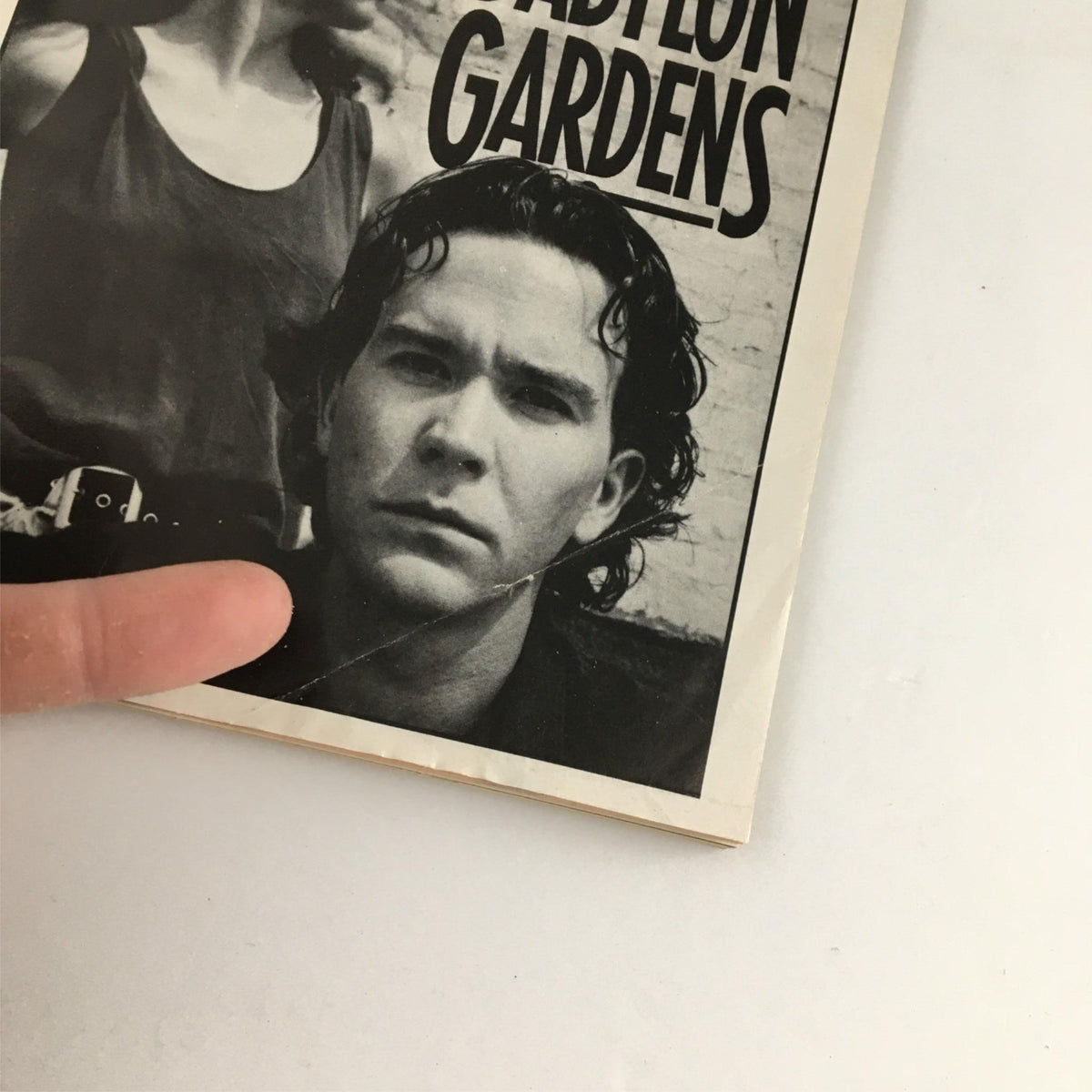 Close-up of the 1991 Playbill for 'Babylon Gardens' by Circle Repertory Company, highlighting a character's portrait from the cover.