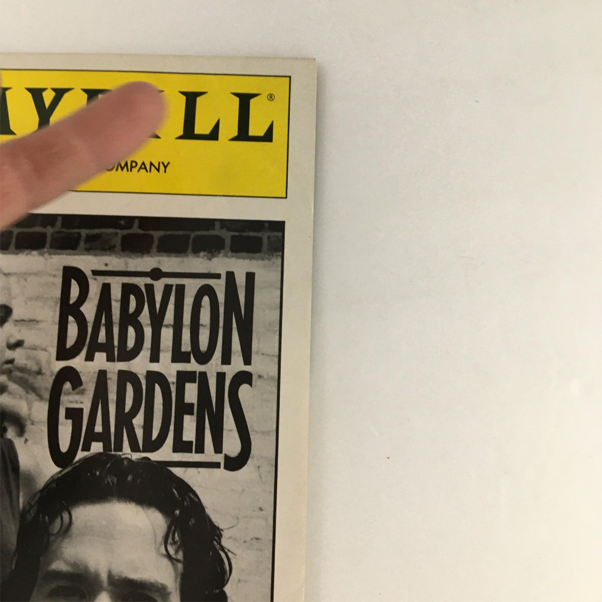 Cover of the 1991 Playbill for 'Babylon Gardens' produced by Circle Repertory Company, featuring bold typography and a striking black and white image.