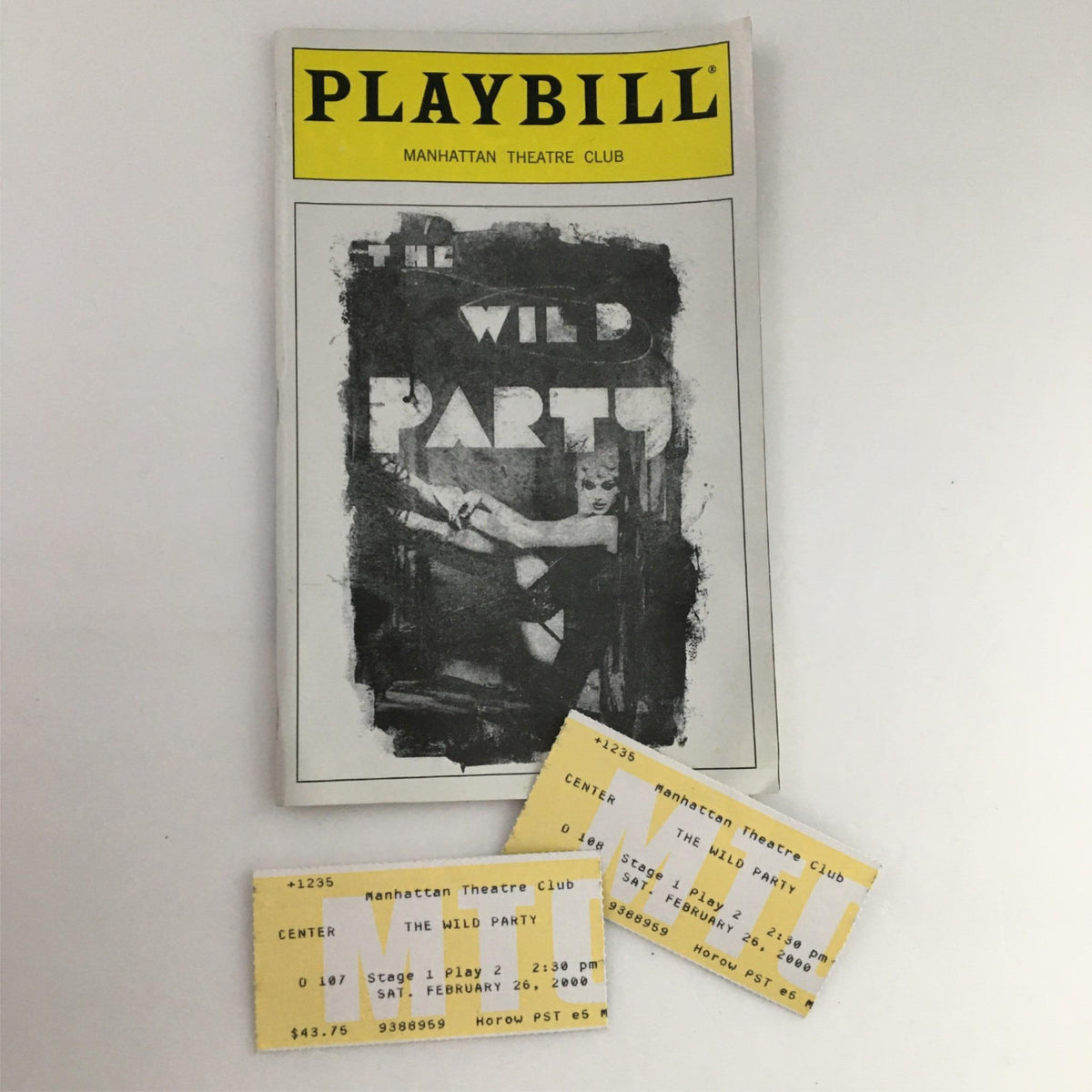 2000 Playbill The Wild Party by Manhattan Theatre Club featuring Idina Menzel, along with original performance tickets, showcasing a vintage theater collectible.