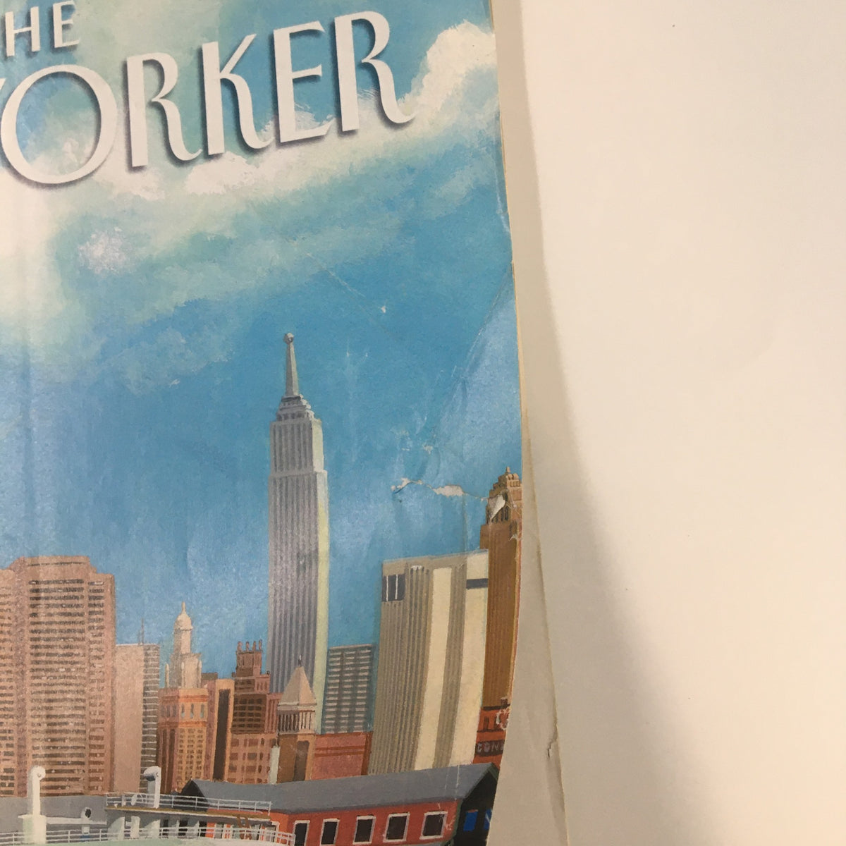 Detail of the cover of The New Yorker Full Magazine September 20, 2004, highlighting the iconic Empire State Building and elements of urban architecture.