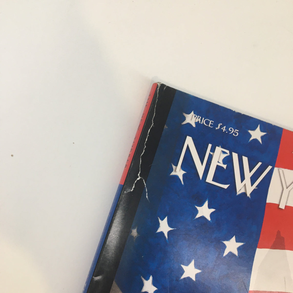 Cover detail of The New Yorker Full Magazine October 18 2004 showing a torn corner with American flag design. An item featuring a cover by Francoise Mouly, titled 'A Shadow Over Election.'