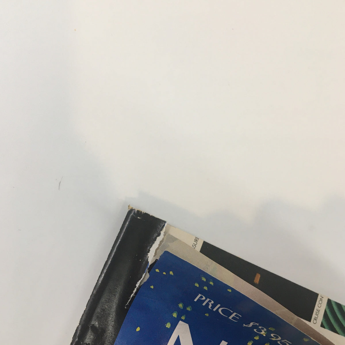 Close-up of the top edge of The New Yorker Full Magazine October 10 2005, showing minor wear including a small rip.