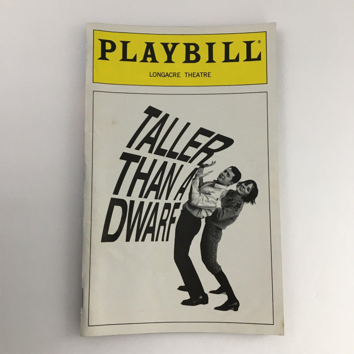 2000 Playbill for 'Taller Than a Dwarf' showcasing the cover design with the title prominently displayed at Longacre Theater.