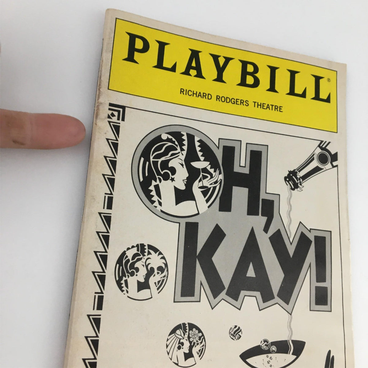Front cover of the 1990 Playbill for Oh, Kay!, featuring bold graphics and the title prominently displayed, from the Richard Rodgers Theatre.