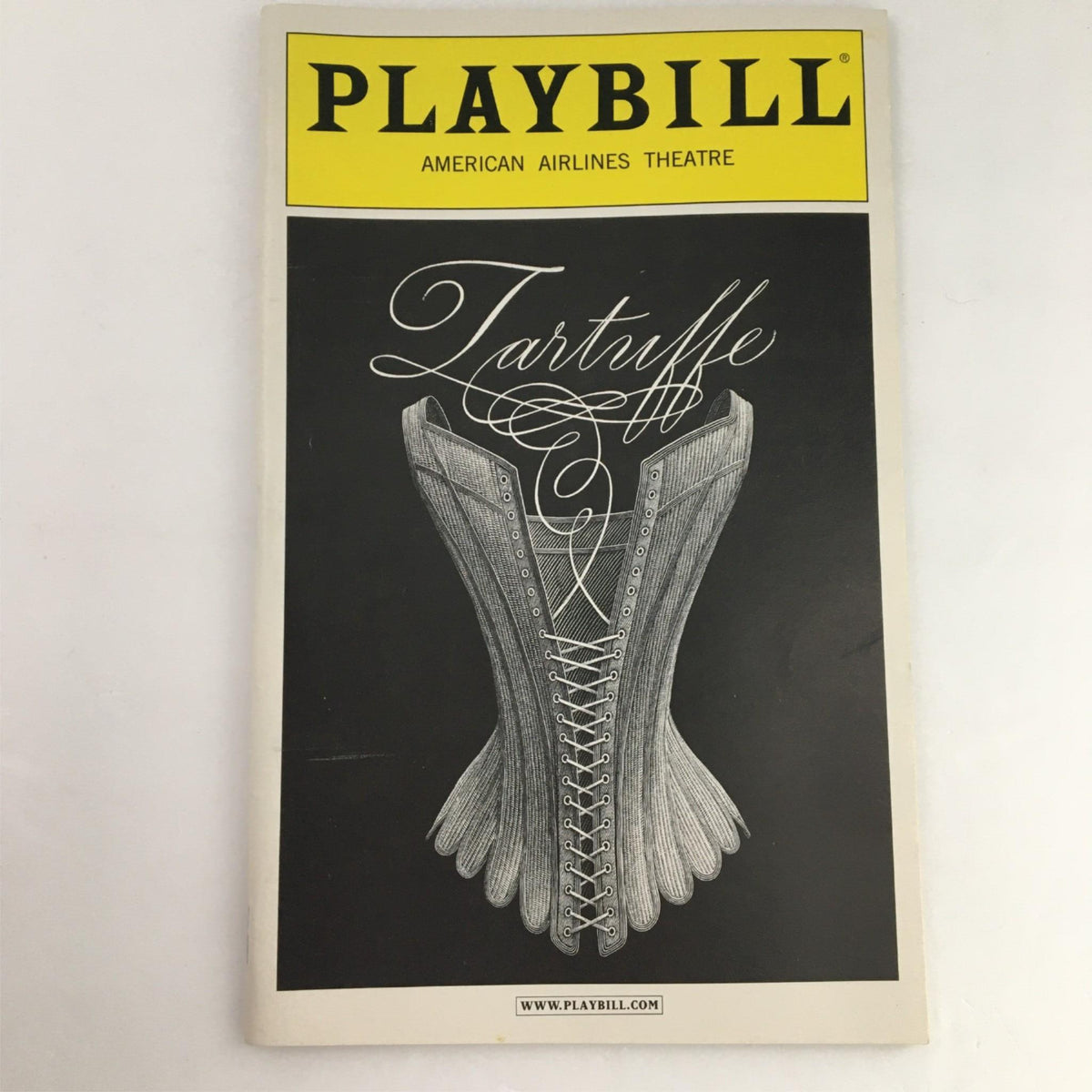 2003 Playbill for Tartuffe by Molière, featuring an artistic illustration of a corset, presented at the American Airlines Theatre.