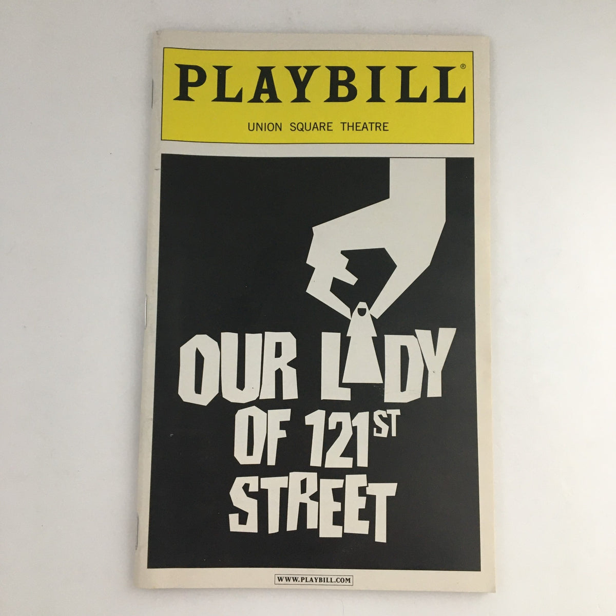 2003 Playbill from Union Square Theatre for 'Our Lady of 121st Street', featuring a striking cover design with a hand holding a key and bold title typography.