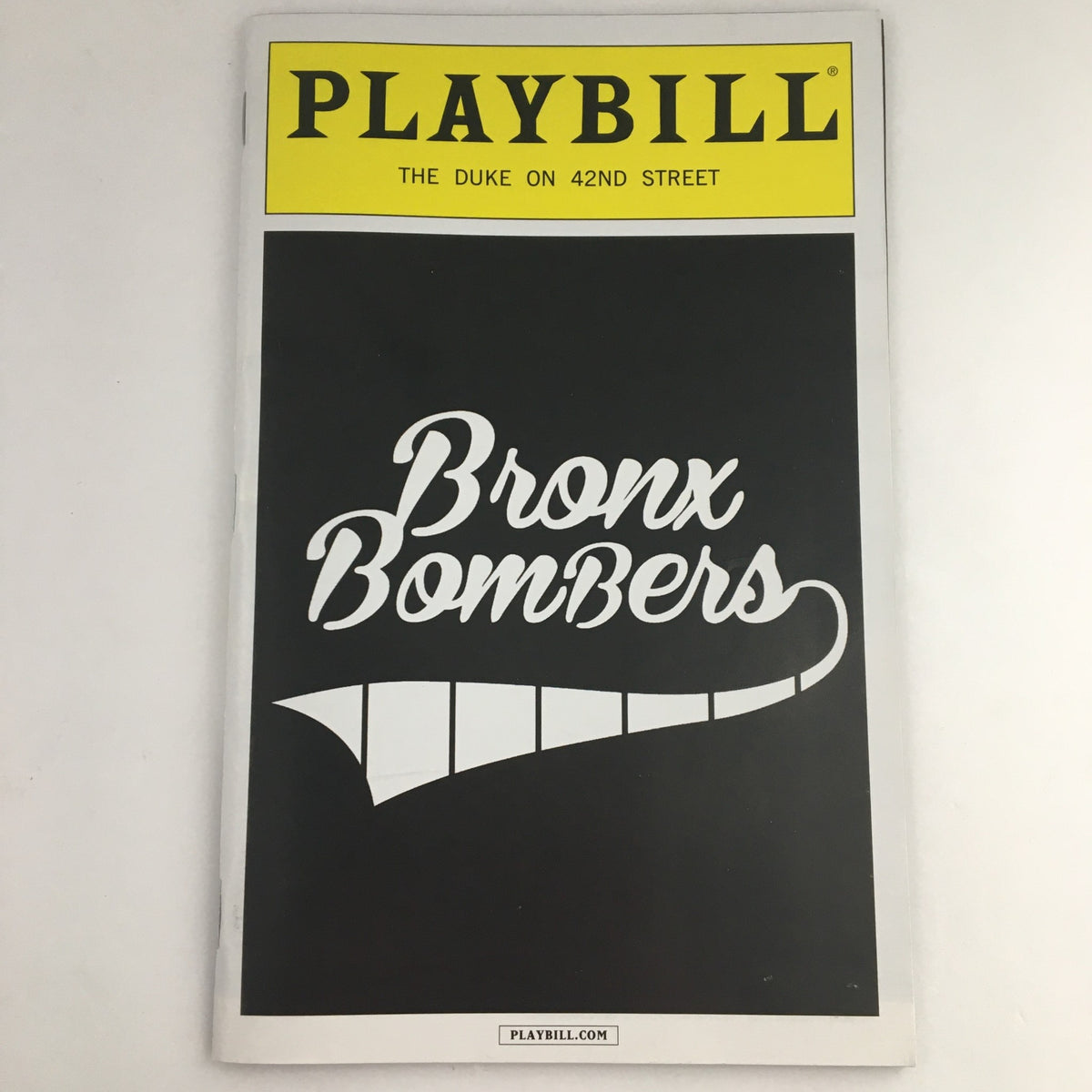2013 Playbill for 'Bronx Bombers' showcasing a close-up of the cover with the bold title.