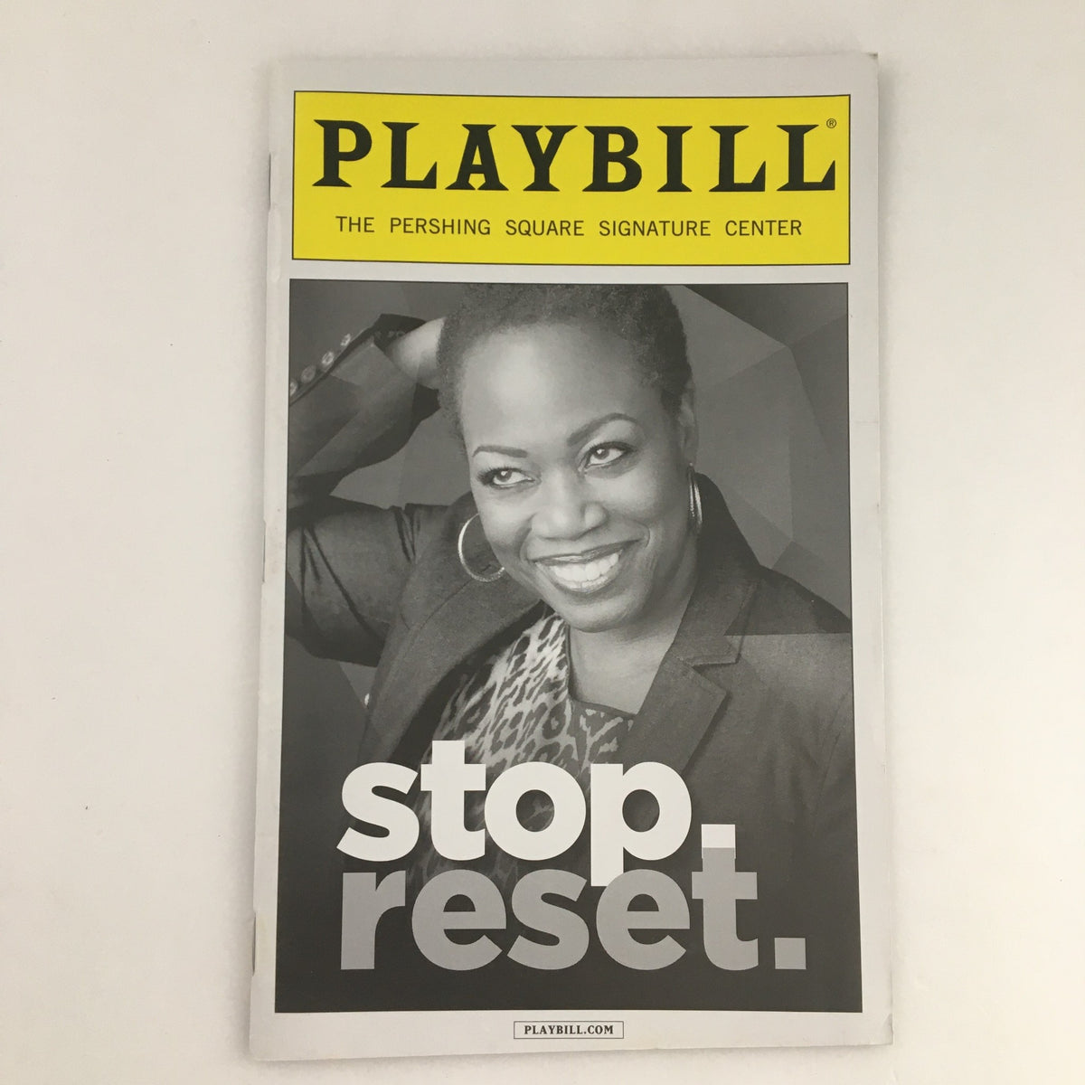 2013 Playbill titled 'Stop Reset' featuring a smiling woman on the cover at the Pershing Square Signature Center.
