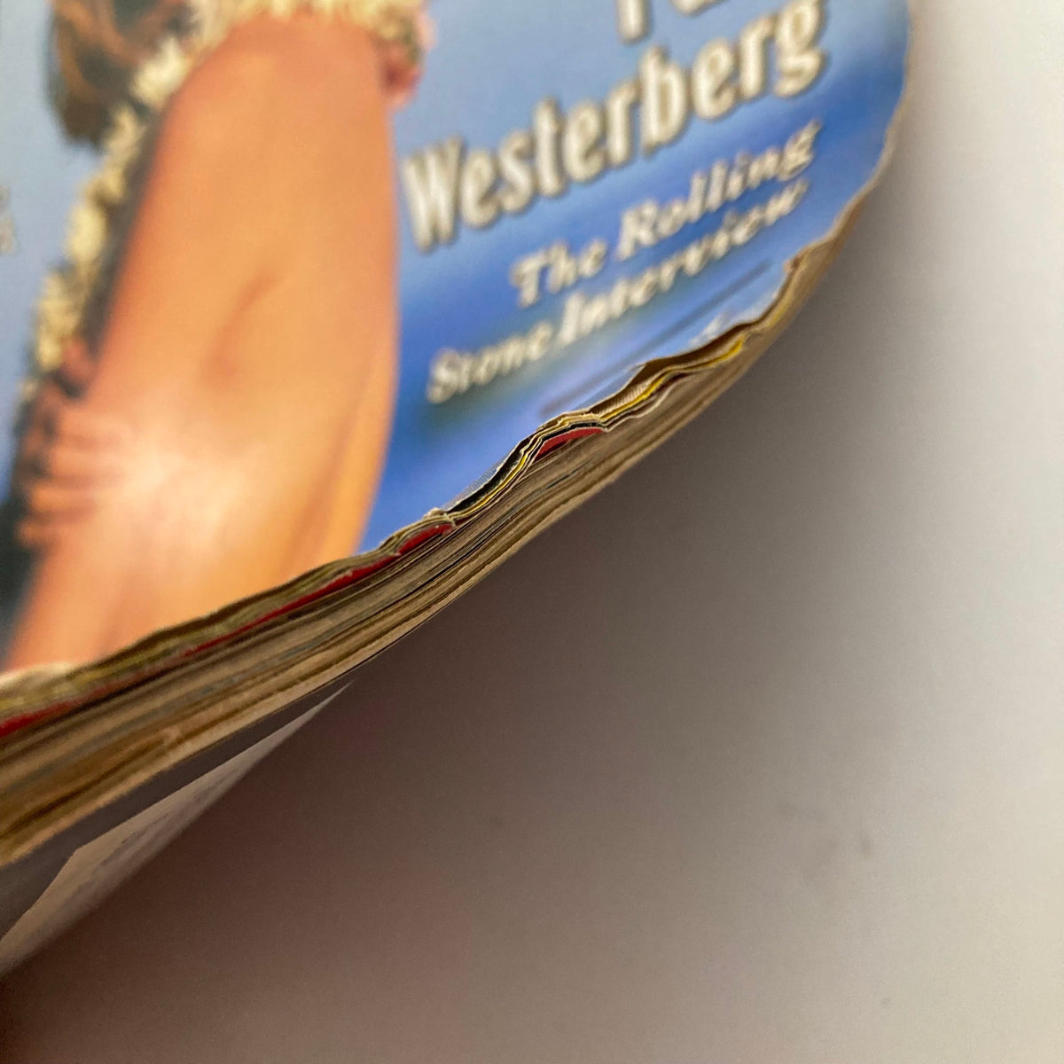 Close-up view of the edge of the Rolling Stone Magazine June 24, 1993, Issue 659, displaying slight wear typical of vintage magazines.