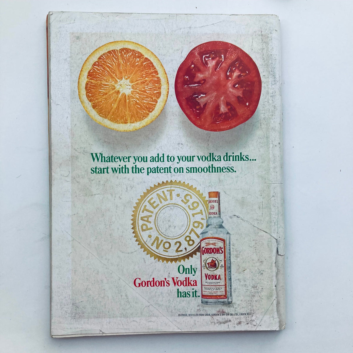 Back cover of VTG Playboy Magazine May 1968, advertising Gordon's Vodka with an image of an orange and a tomato, emphasizing the classic design and retro branding.
