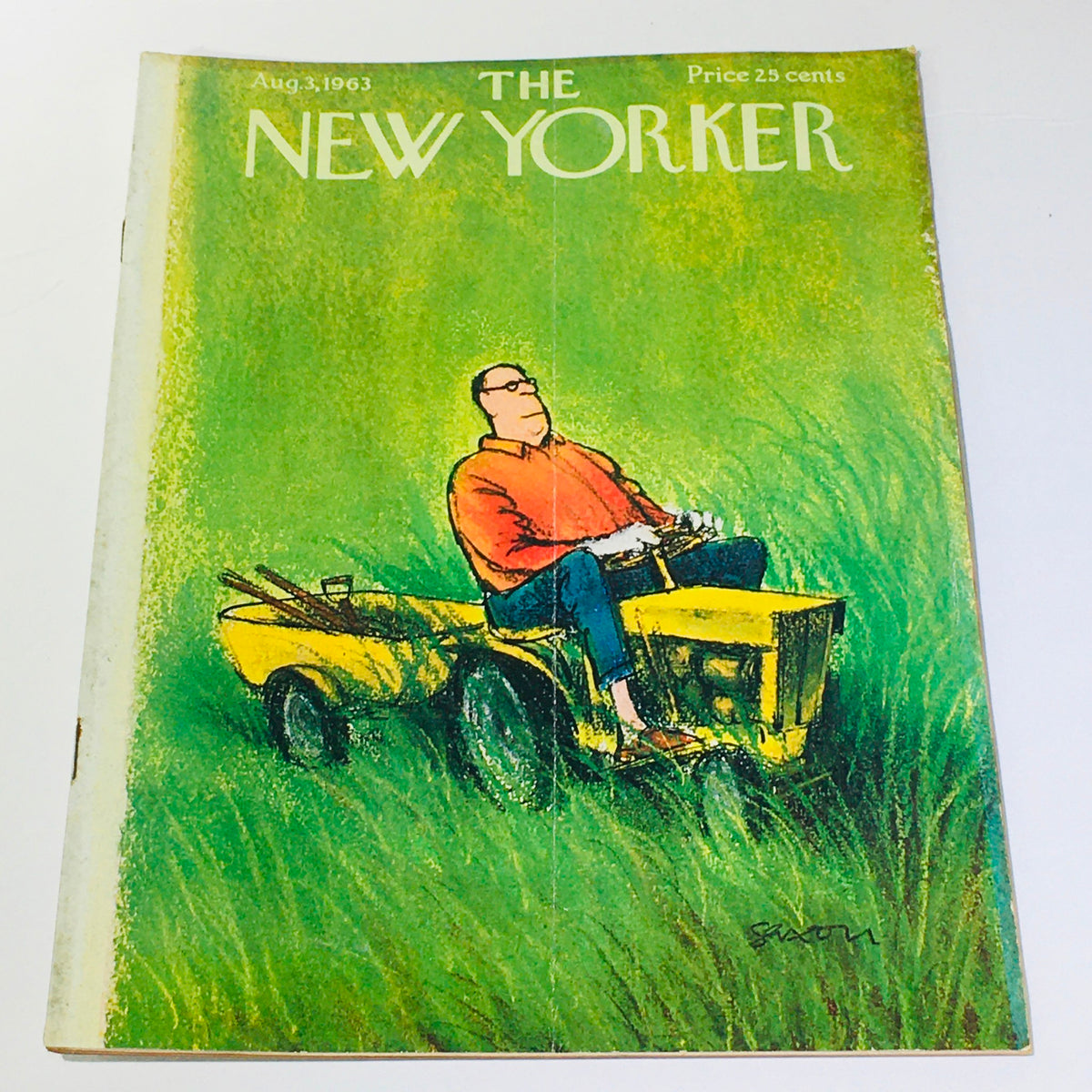 The New Yorker: August 3, 1963 - Cover featuring a man on a yellow lawn tractor amidst tall green grass, designed by Charles Saxon.