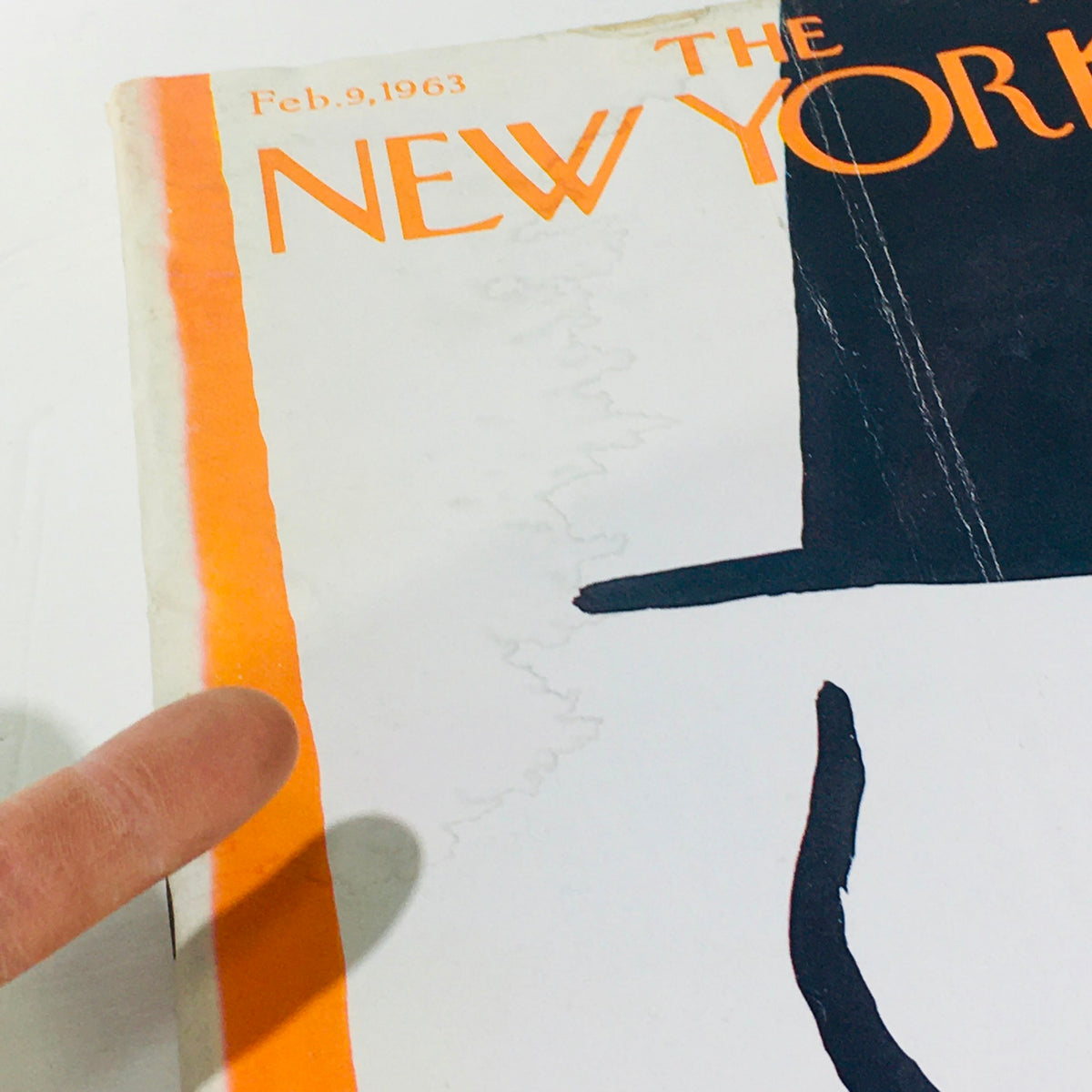 Close-up view of the cover of The New Yorker: February 9 1963, showcasing the unique design elements and wear of the magazine, emphasizing the vintage style.