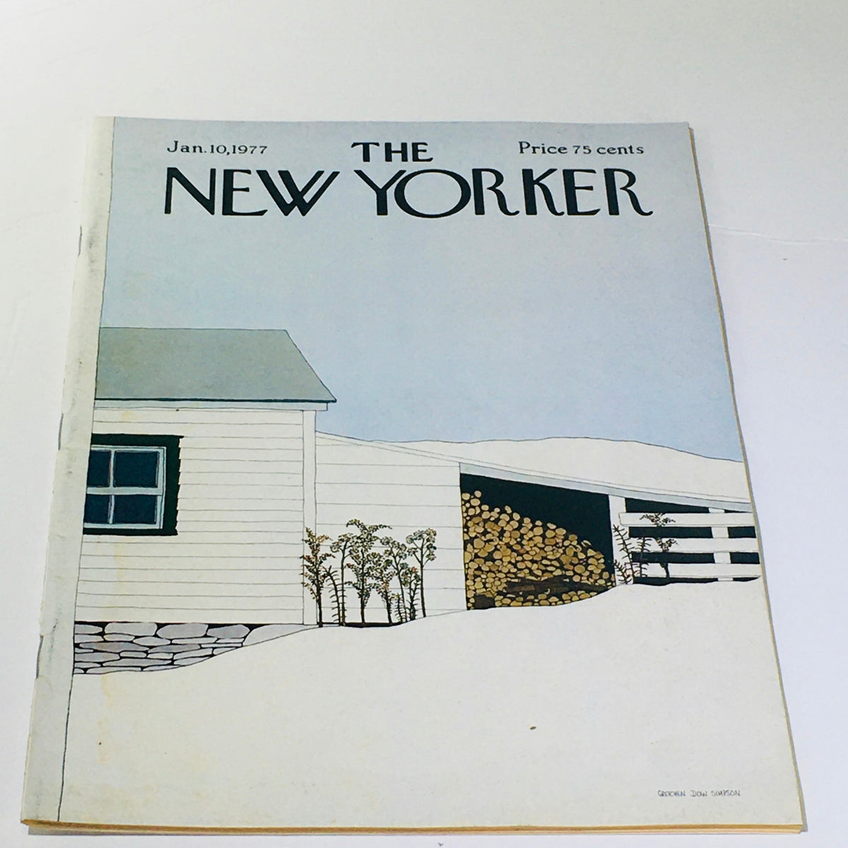 The New Yorker: January 10, 1977 magazine cover featuring a minimalist illustration of a white house with a gray roof, surrounded by snow and woodpile, designed by Gretchen Dow Simpson.