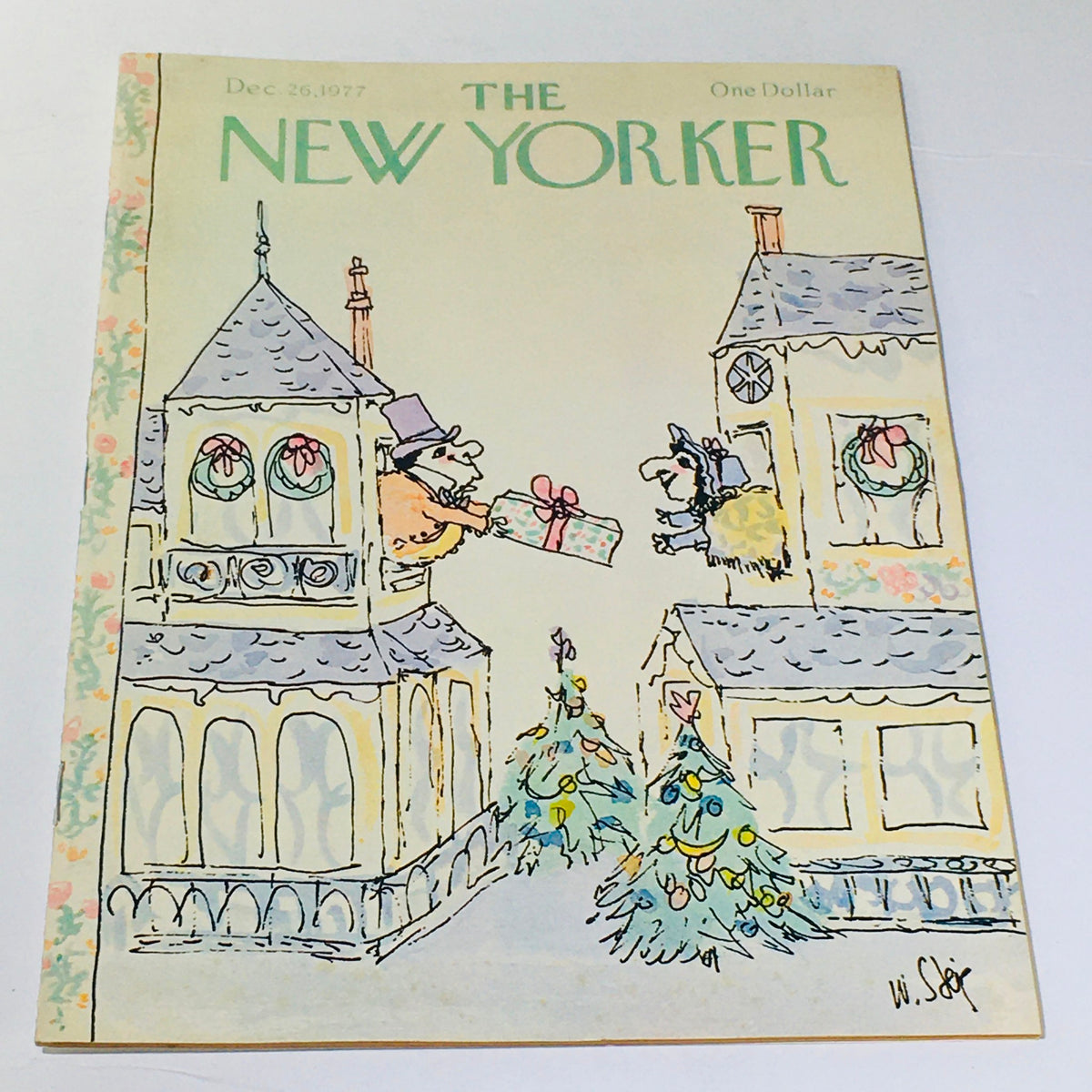 The New Yorker: December 26, 1977 cover featuring whimsical cartoon illustration by William Steig, depicting characters exchanging gifts among holiday decorations and trees.