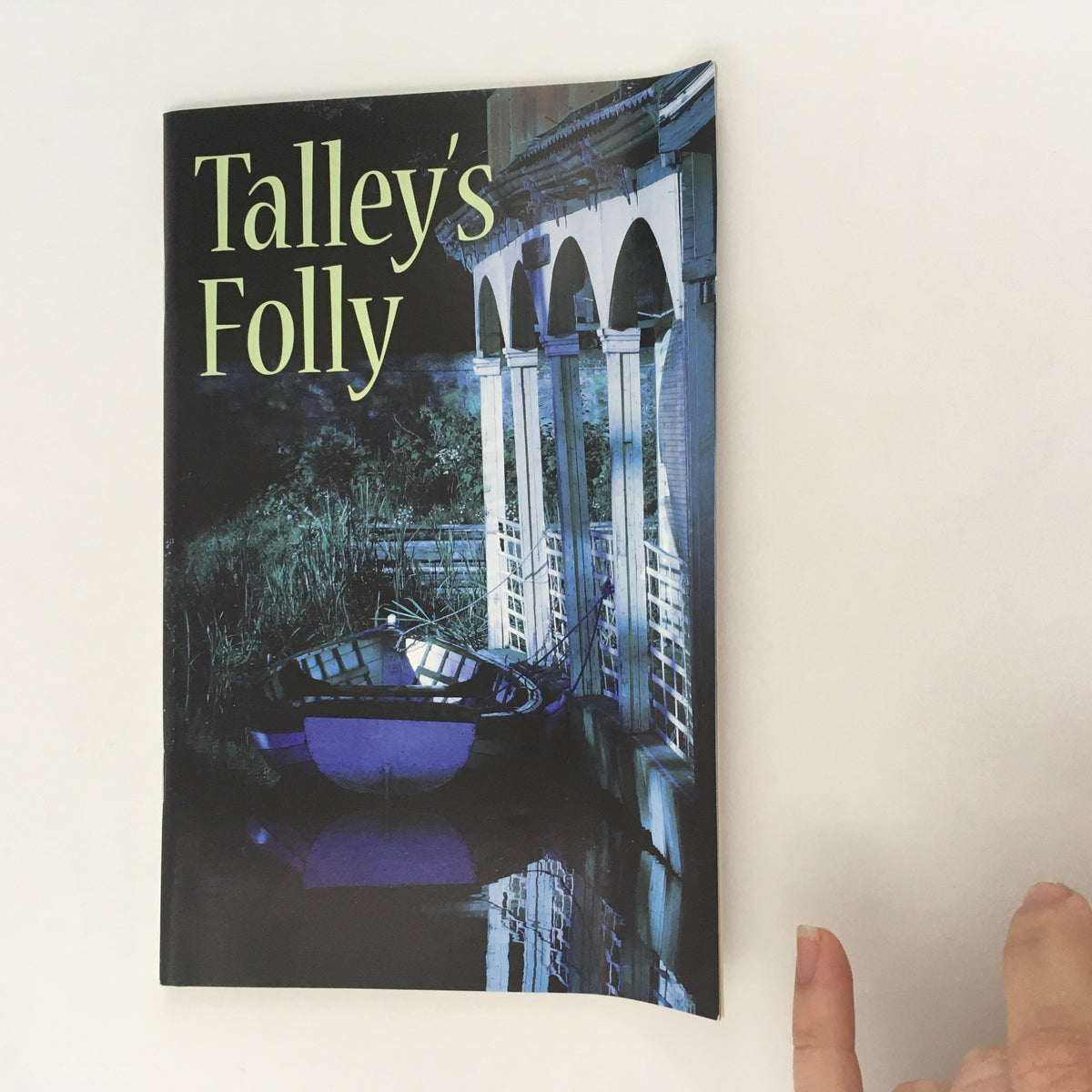 Alternate view of the cover of the 2008 McCarter Theatre Center program for 'Talley's Folly' by Lanford Wilson, highlighting a serene water scene with a boat.