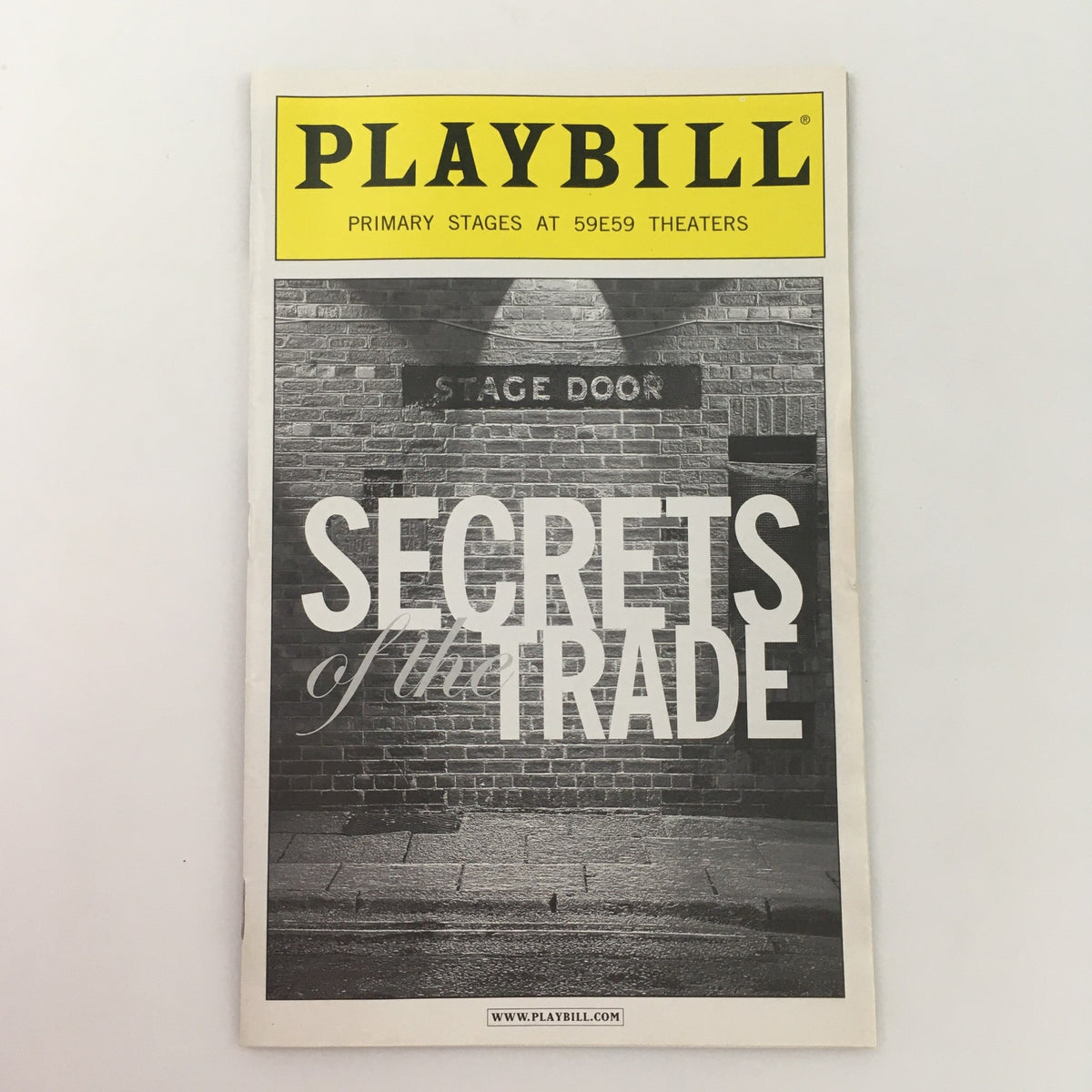2010 Playbill Primary Stages Secrets of the Trade cover featuring the stage door and title prominently displayed.