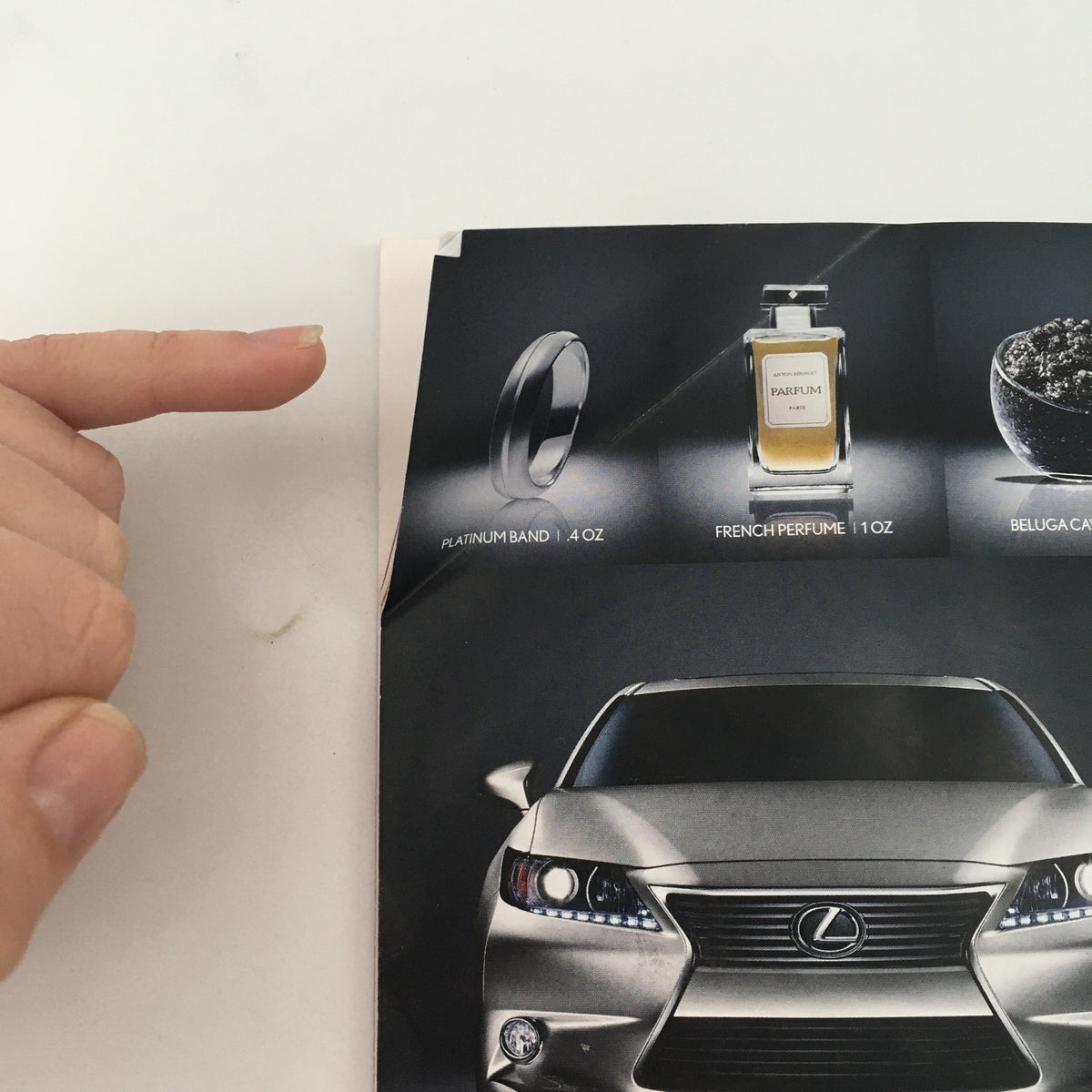 Close-up view of a featured advertisement in the 2014 Playbill for 'The Oldest Boy', displaying jewelry and luxury items.
