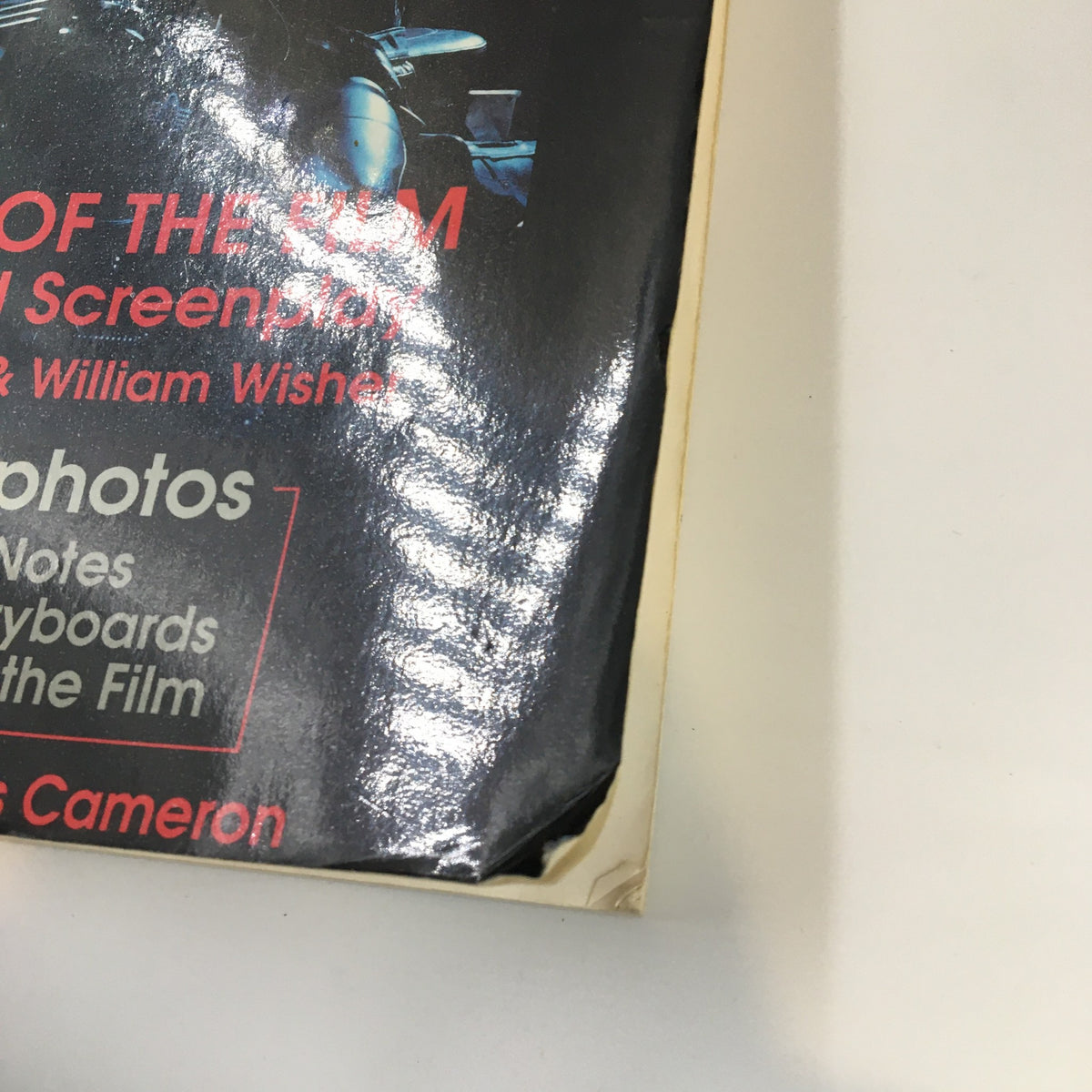 Close-up view of the cover of '1991 Terminator 2 Judgement Day The Book of The Film An Illustrated Screenplay' highlighting its black and red design.
