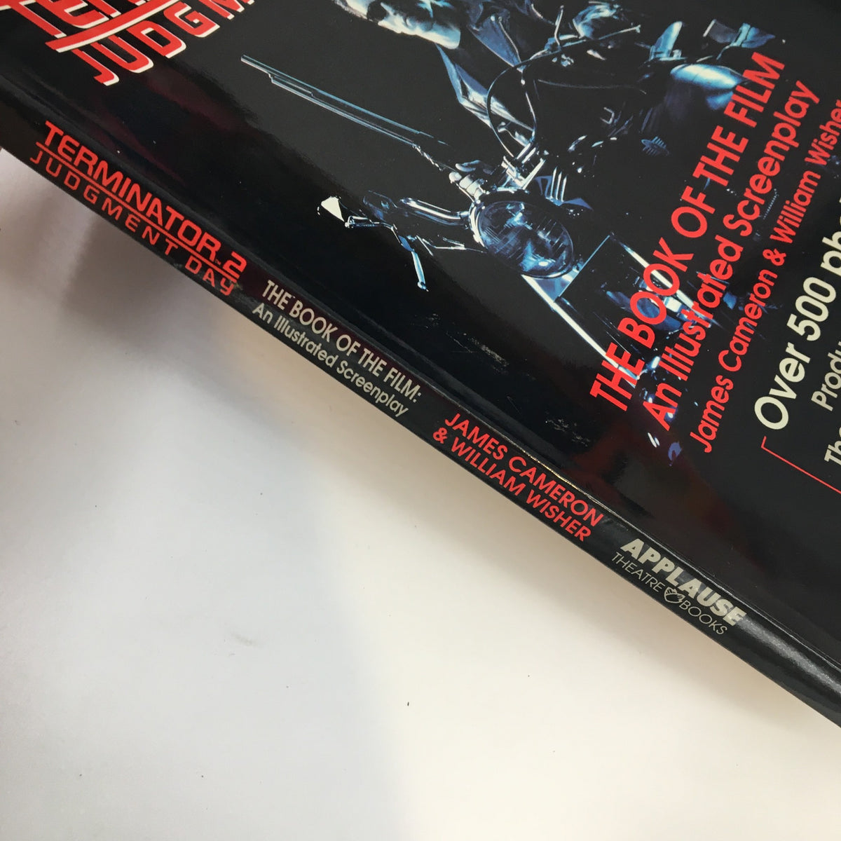 Side view of '1991 Terminator 2 Judgement Day The Book of The Film An Illustrated Screenplay' displaying its spine detailing and authors' names.