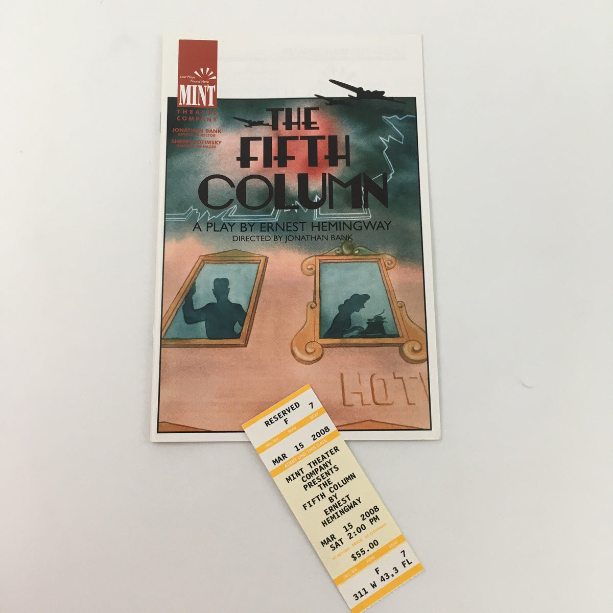 Cover image of the 2008 Mint Theater Company production of 'The Fifth Column' by Ernest Hemingway, accompanied by original tickets from the event, showcasing a blend of play graphics and ticket design.