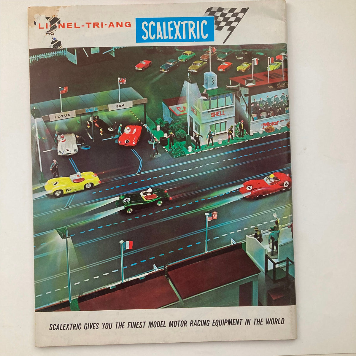 Cover of the 1962 Lionel Trains and Accessories Model Motor Racing Catalog featuring Scalextric model racing scene with vibrant racing cars and track details.