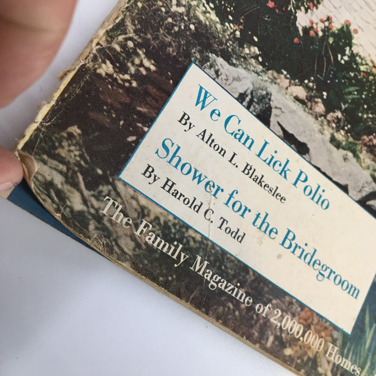 Close-up of the edge of Vintage Household Magazine June 1949, highlighting wear and article titles including 'We Can Lick Polio'.