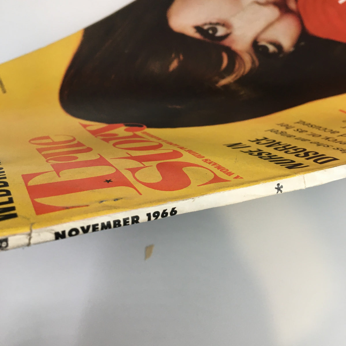 Close-up view of the spine of VTG True Story Magazine November 1966 showcasing the publication date and general wear, indicative of its vintage nature.