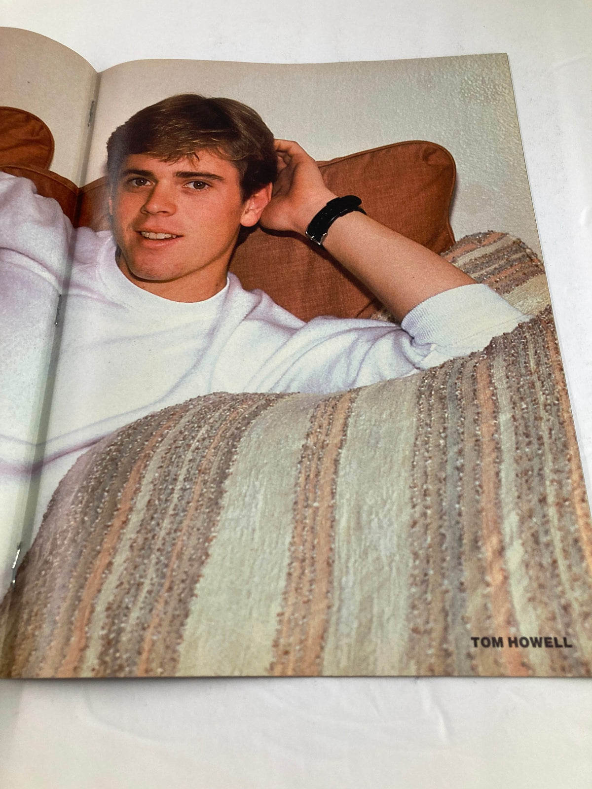 Photograph of Tom Howell lounging on a couch, included in VTG All Star Color Centerfolds February 1985 Vol 31 #6 Sting w Poster No Label.