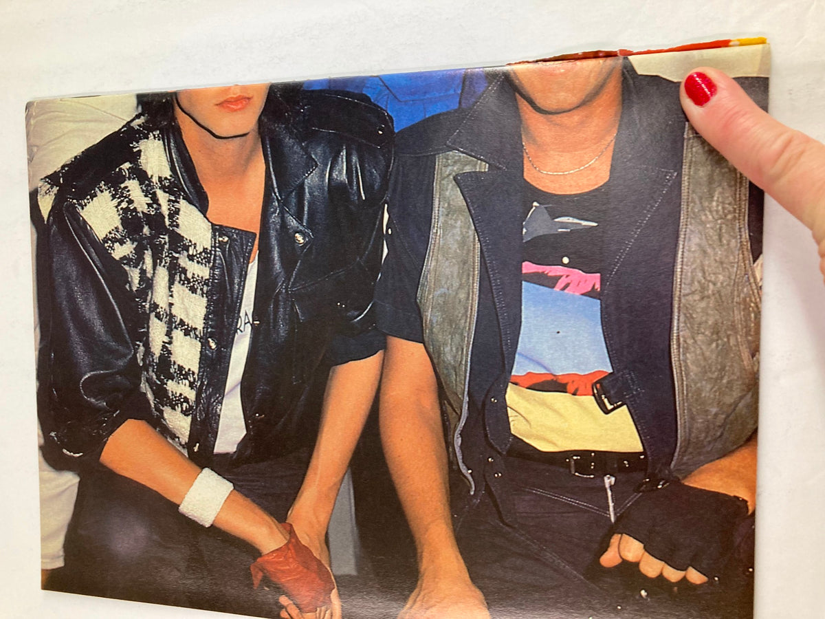 Close-up of two individuals in 1980s fashion, from VTG All Star Color Centerfolds February 1985 Vol 31 #6 Sting w Poster No Label.