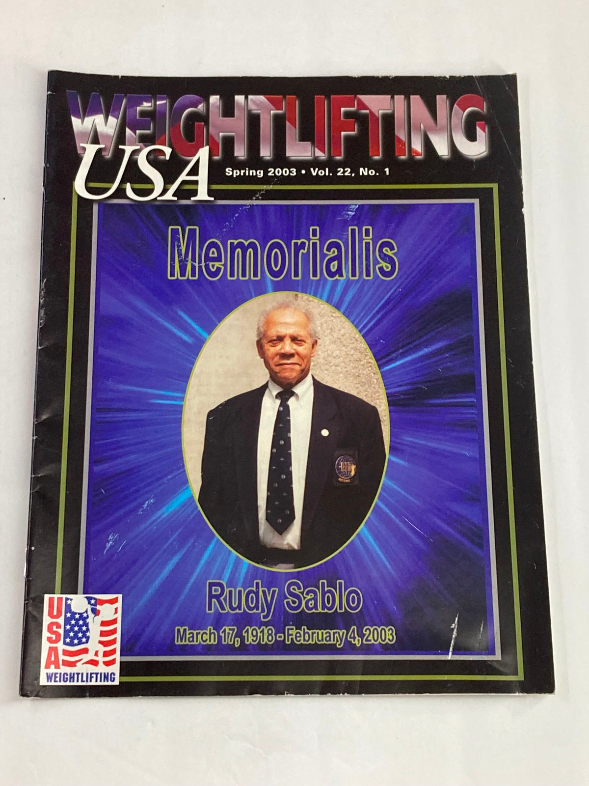 Cover of Weightlifting USA Magazine Vol 22 #1 Spring 2003 featuring Rudy Sablo Memorialis, honoring the legacy of weightlifting champion Rudy Sablo.