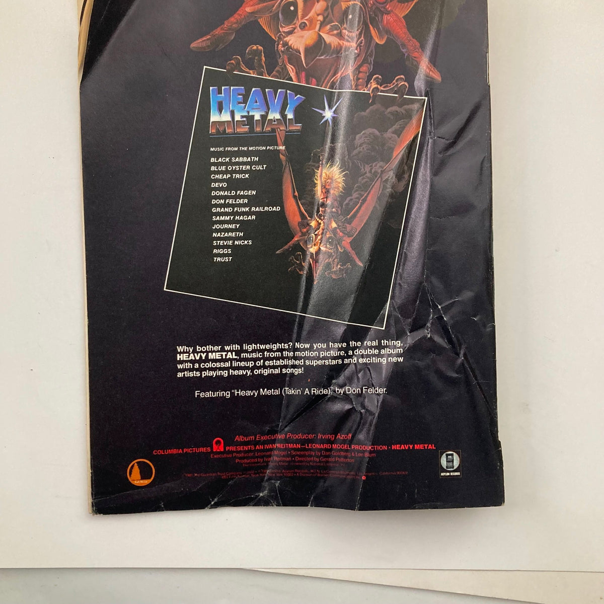 Back cover of Country Hits Magazine Winter 1981 with an advertisement for the Heavy Metal soundtrack, portraying popular music artists of the time.