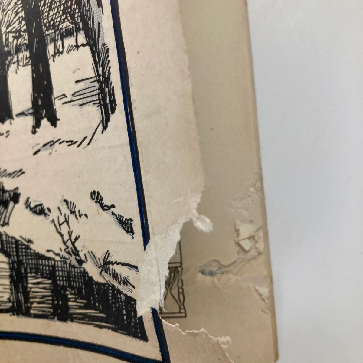 Close-up of the torn edge of the cover of VTG The Railroad Trainman Magazine January 1931, showcasing its vintage condition.