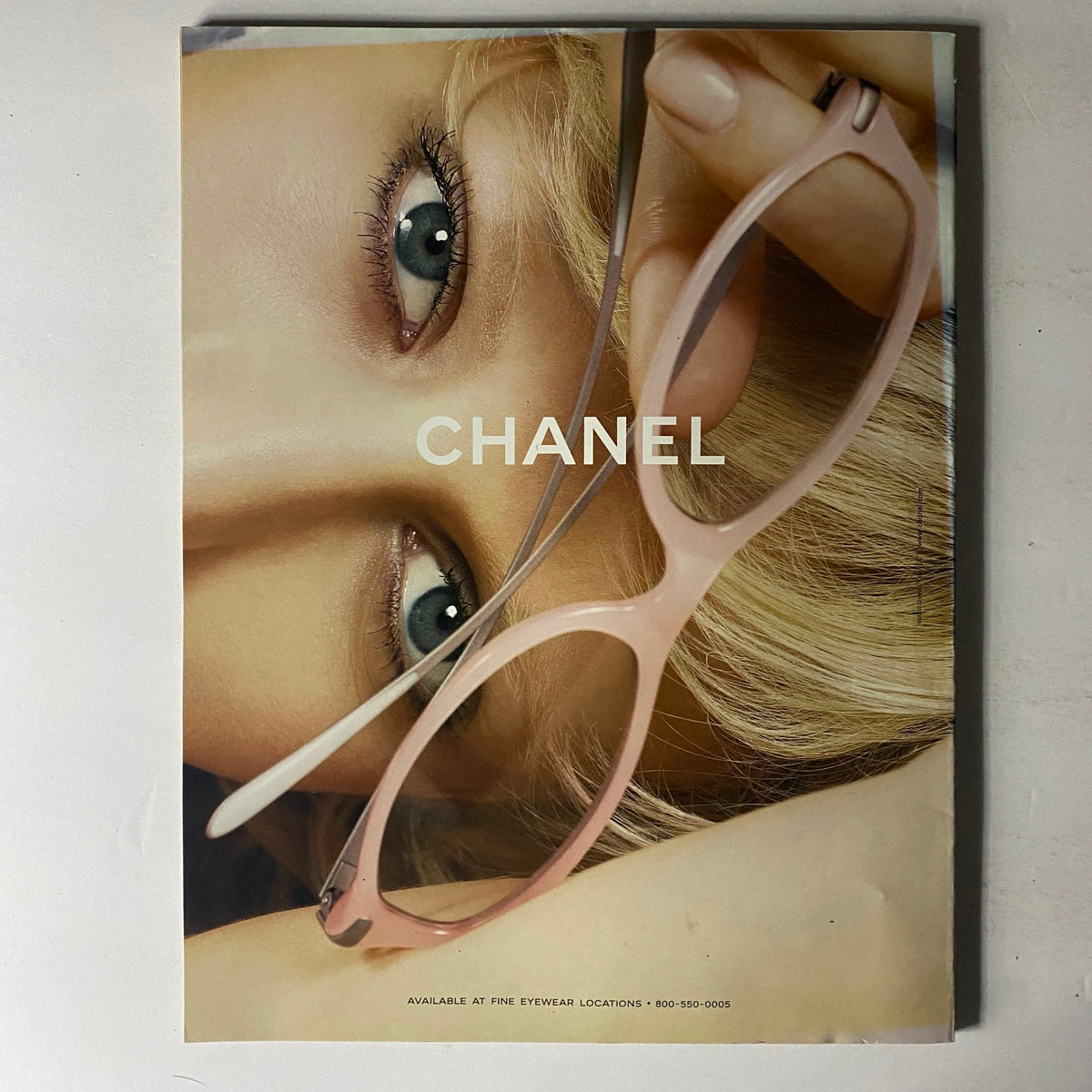 Cover of a Chanel eyewear advertisement featured in W Magazine January 2003, showcasing stylish glasses on a model.