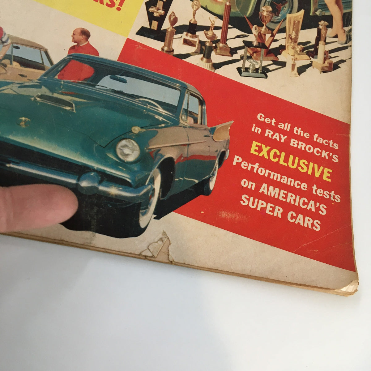 Close-up of the May 1958 Hot Rod Magazine cover focusing on a blue vintage car with trophies, illustrating the competitive spirit of car shows during the era.