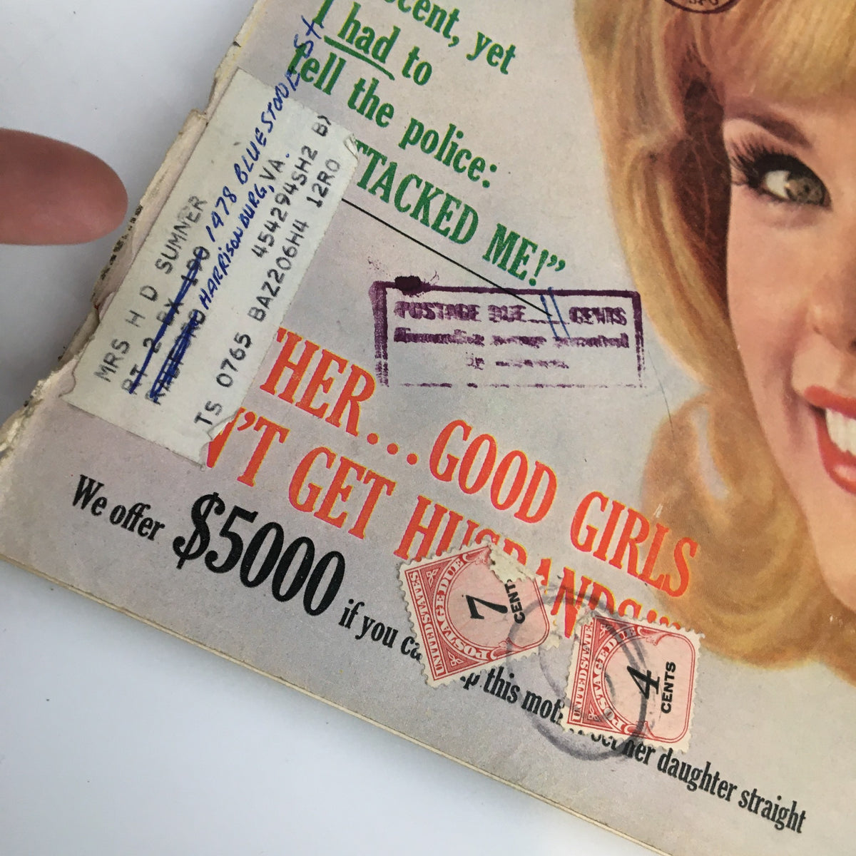 Vintage True Story Magazine December 1964 cover featuring a woman's address label and postage stamps, illustrating the era's mailing practices.