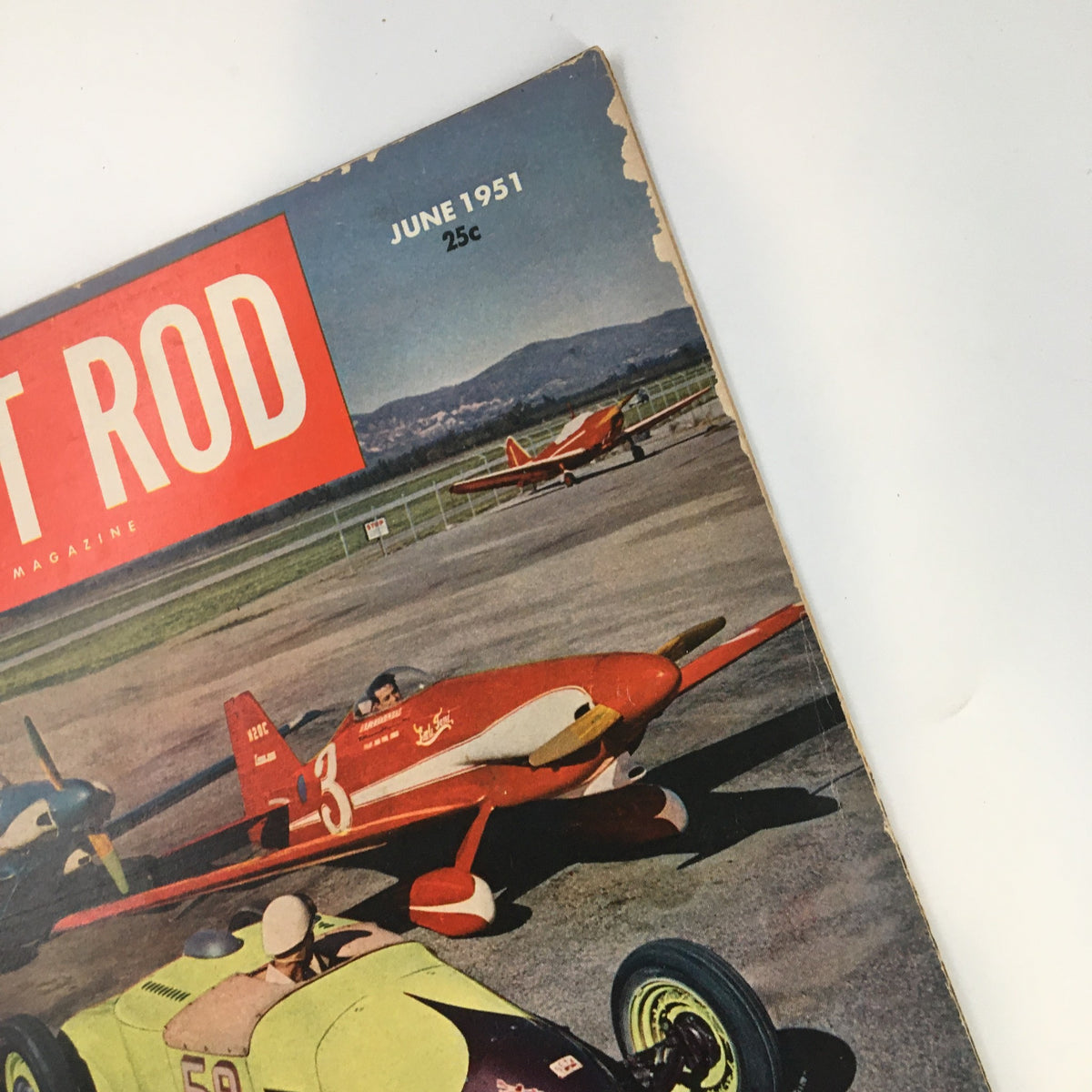 Close-up of Hot Rod Magazine June 1951 cover highlighting a red airplane and a modified stock car, emphasizing the synergy of automotive and aeronautical design.