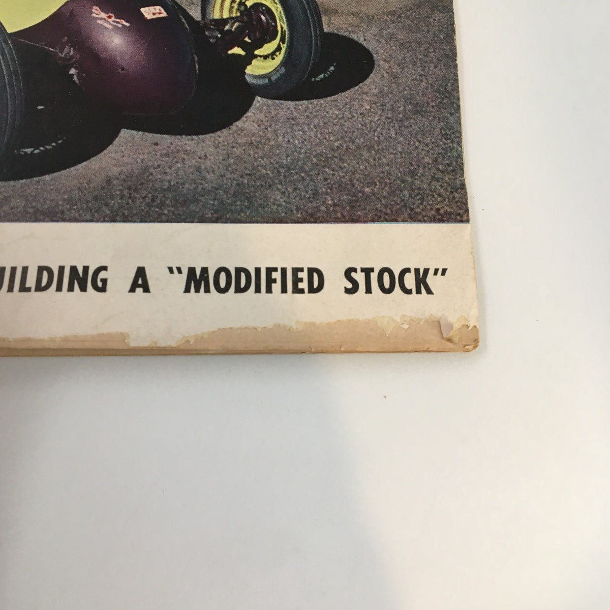 Bottom section of Hot Rod Magazine June 1951 cover displaying the title 'Building a Modified Stock' alongside a modified stock car, reflecting the magazine's theme.