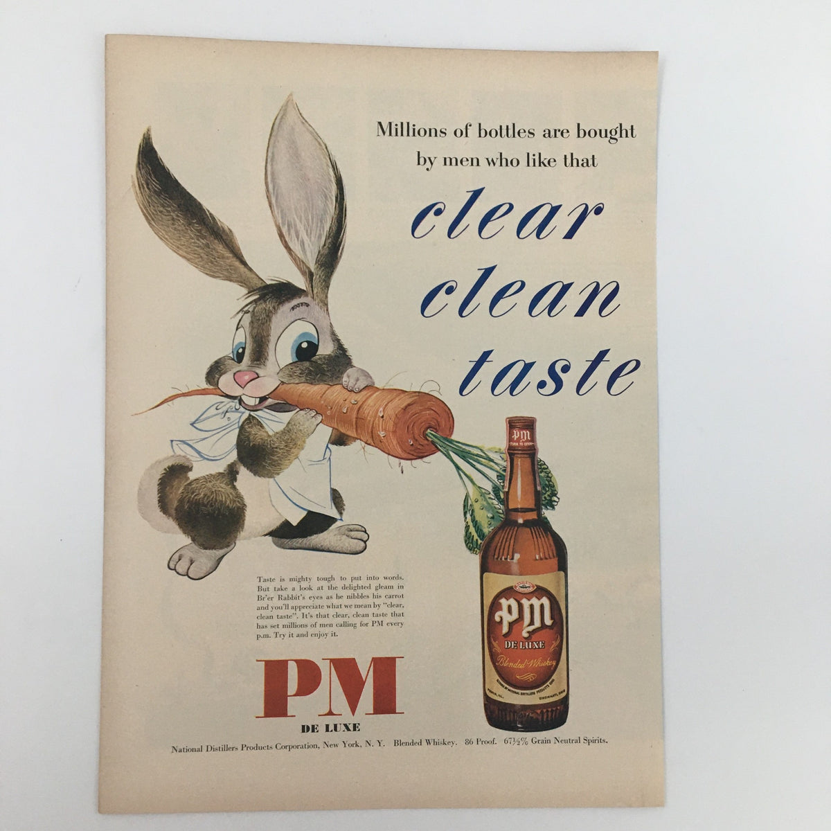 1950 PM De Luxe Blended Whiskey 86 Proof Vintage Print Ad featuring a cartoon bunny holding a carrot, promoting a clear clean taste.