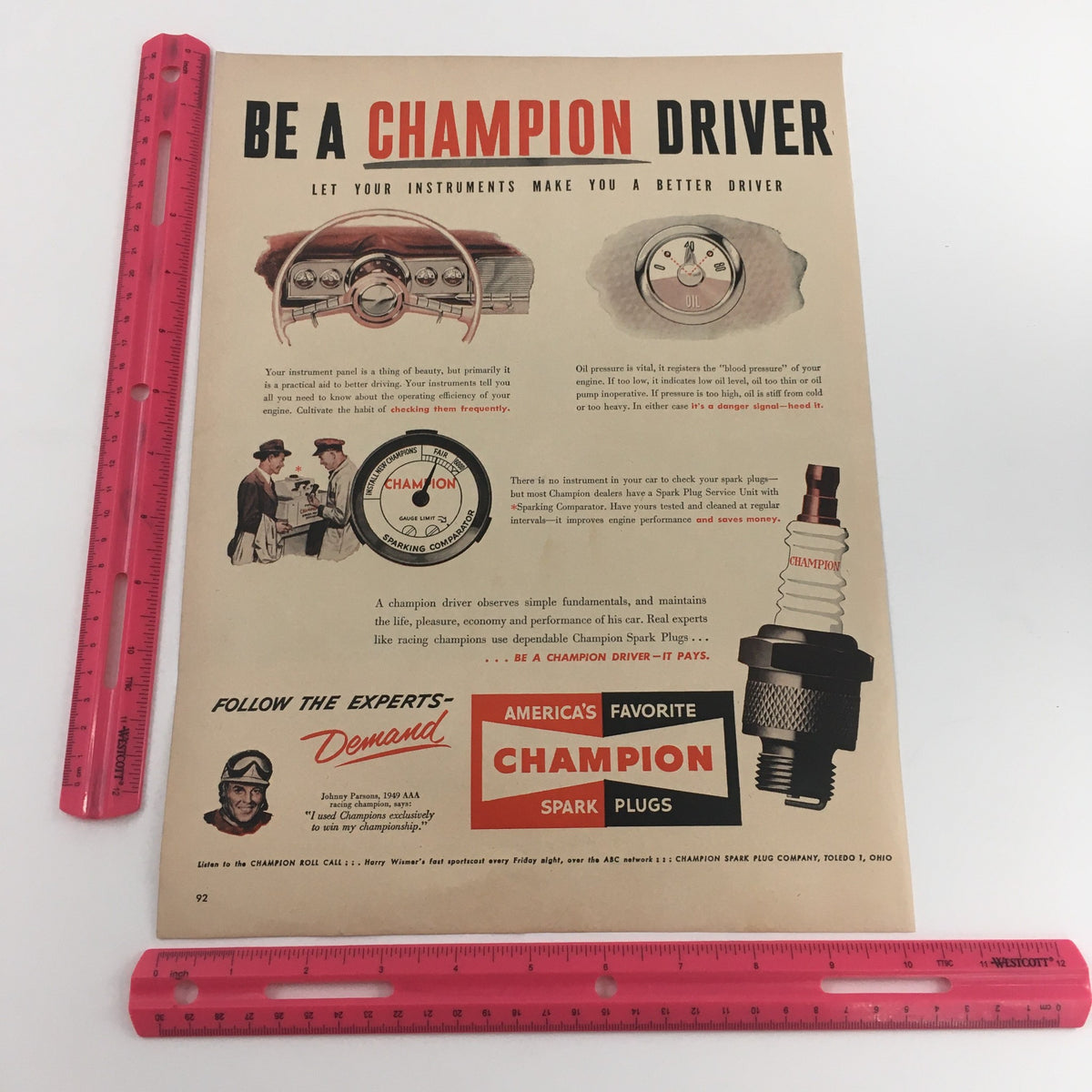 1950 Champion Spark Plugs America's Favorite Vintage Print Ad showcasing dashboard instruments and a spark plug, encouraging safe driving with Champion products.