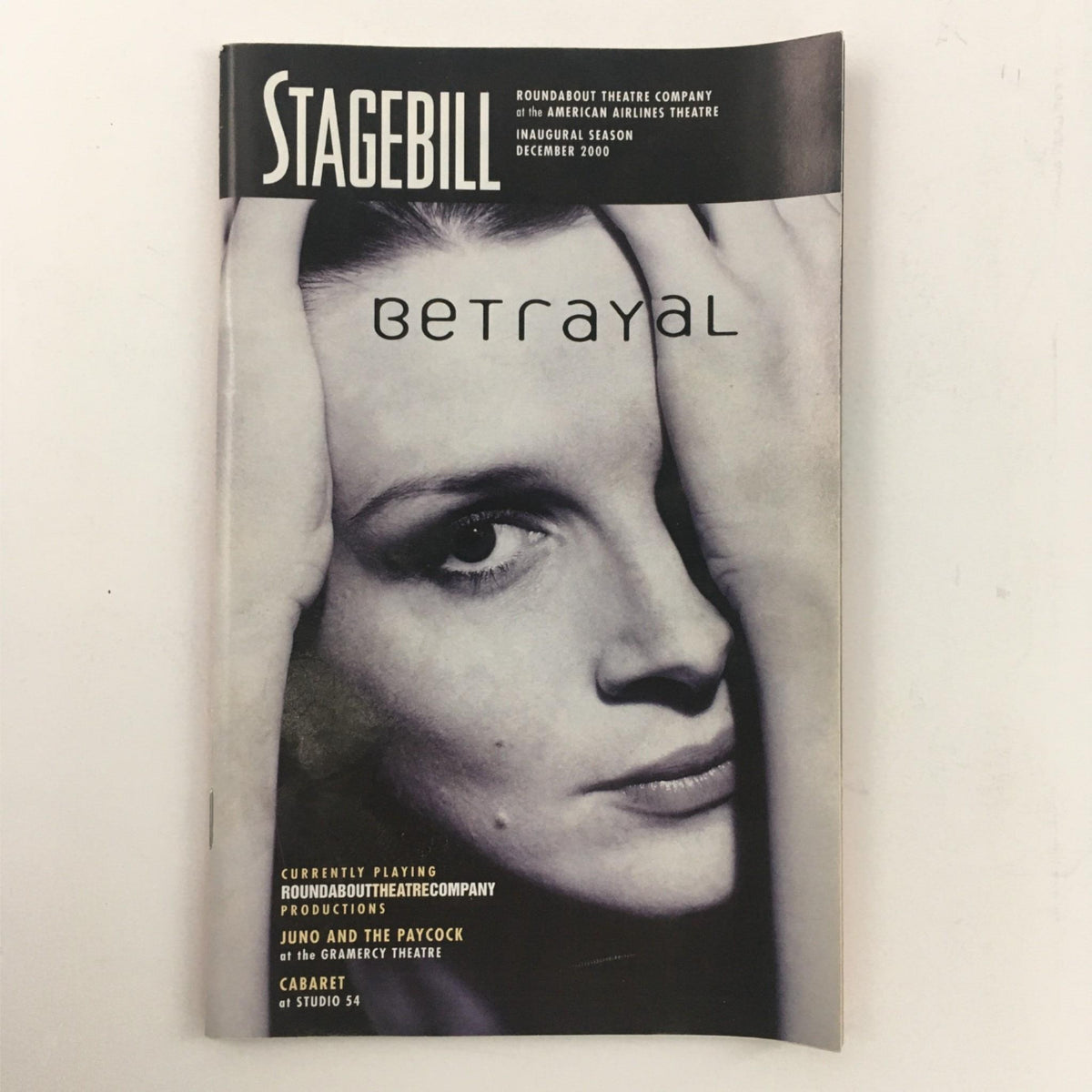 Front cover of the 2001 Stagebill for 'Betrayal' by Harold Pinter featuring a striking black and white image of a woman. This edition is from the American Airlines Theatre.
