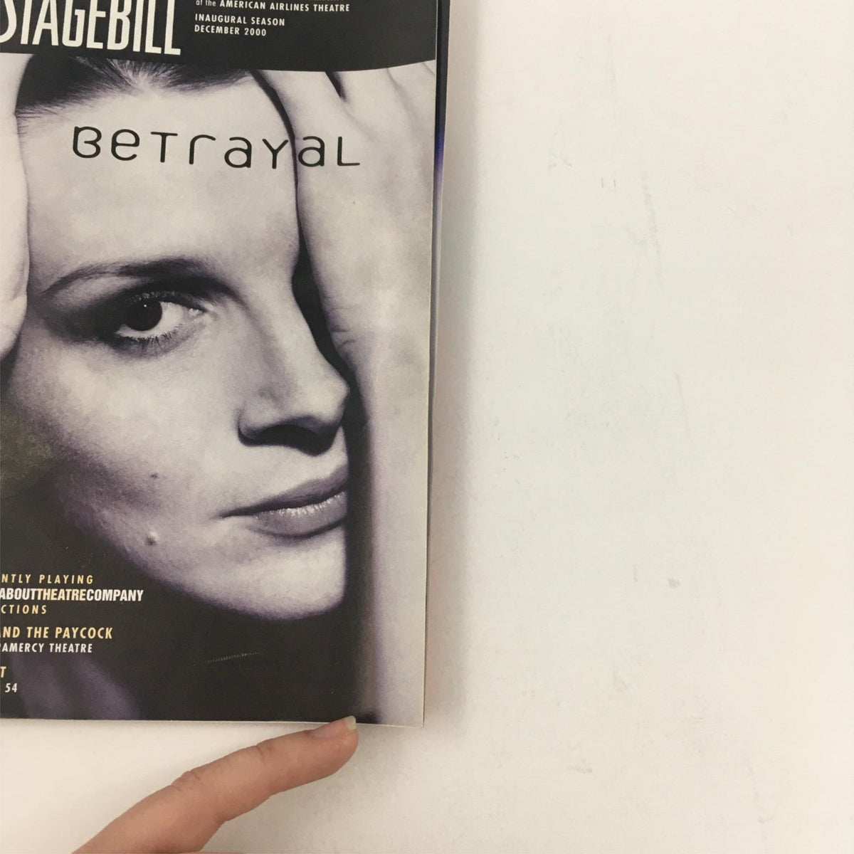 Cover of the 2001 Stagebill for 'Betrayal' featuring a monochrome image of a woman's face, related to the theatrical production at American Airlines Theatre.