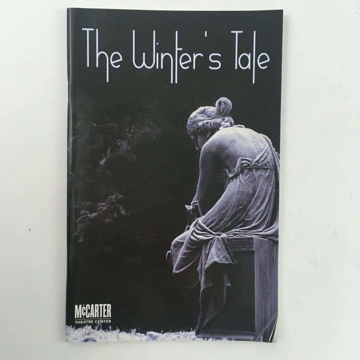 Cover of 'The Winter's Tale' by William Shakespeare at McCarter Theatre Center, showcasing an artistic statue with the title prominently displayed.