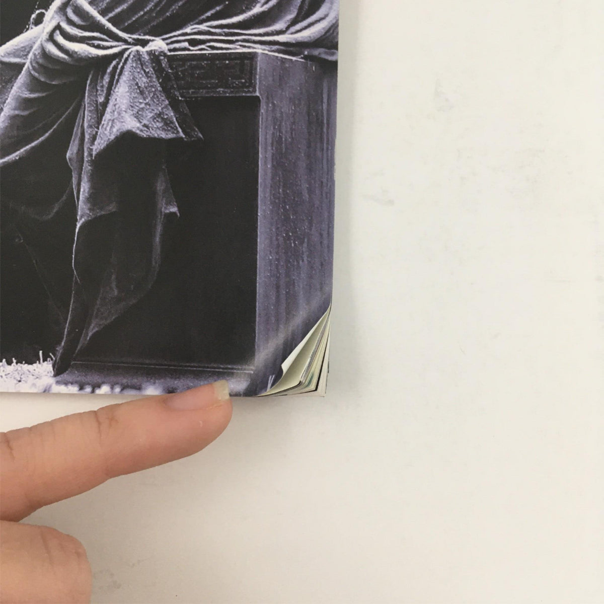 Close-up of the bent corner of 'The Winter's Tale' program by Shakespeare, indicating minor wear and tear, yet in good condition.