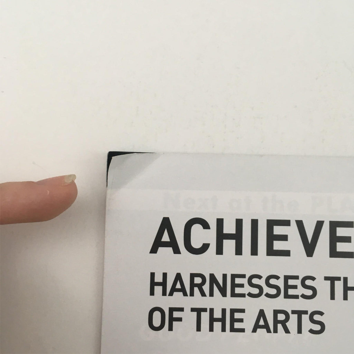Close-up image showing the bent corner of the program for 'The Best of Enemies' by Mark St. Germain, highlighting minor wear and condition details.