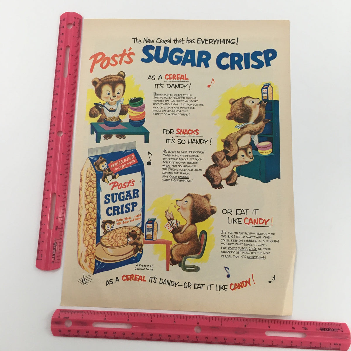 Vintage print ad for Post's Sugar Crisp, displaying the cereal box with adorable animated characters and highlighting its versatility as a snack or candy.