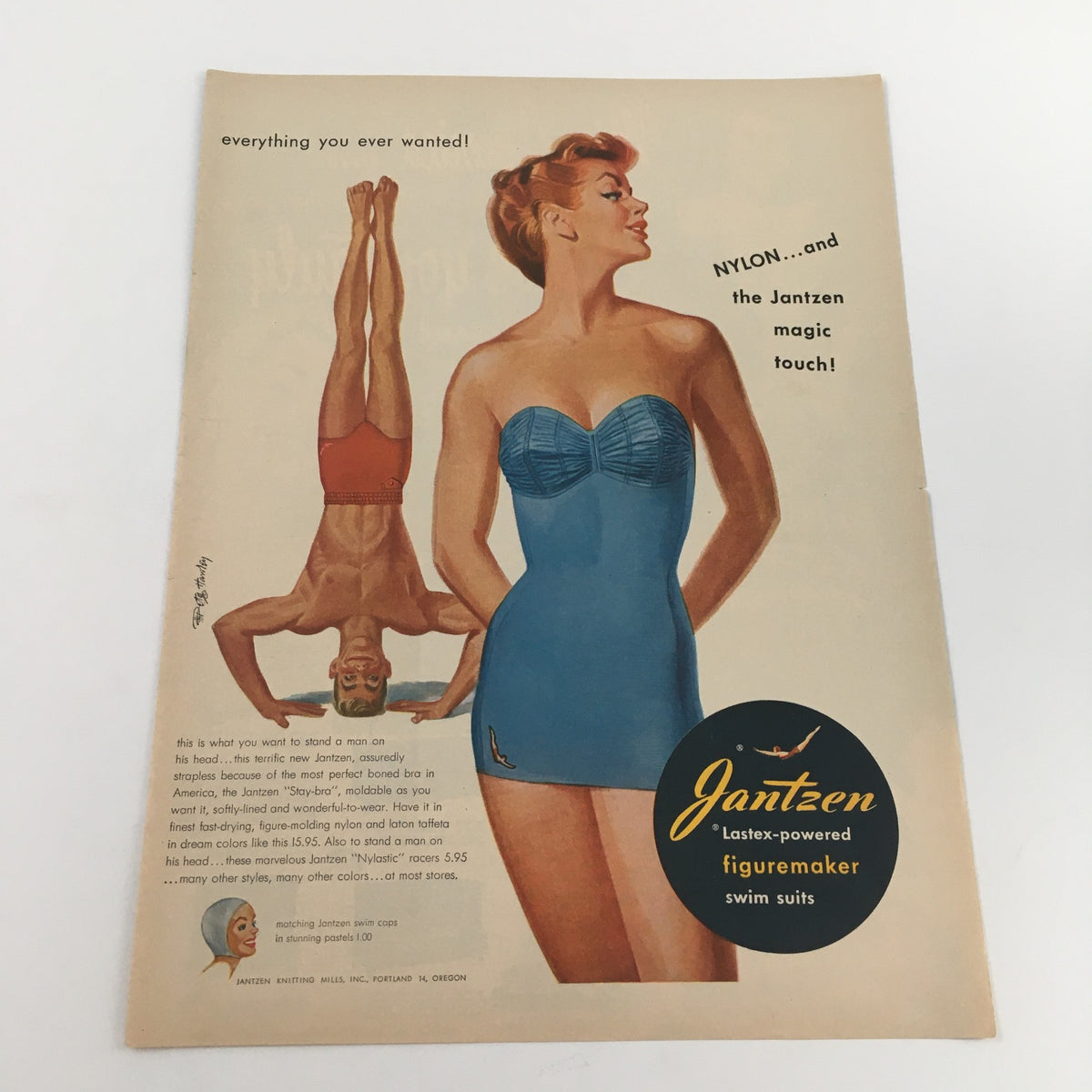 1950 Jantzen Lastex-Powered Figuremaker Swim Suits Vintage Print Ad featuring a stylish woman in a blue swimsuit with a retro design, highlighting the innovative Lastex material for comfort and fit.