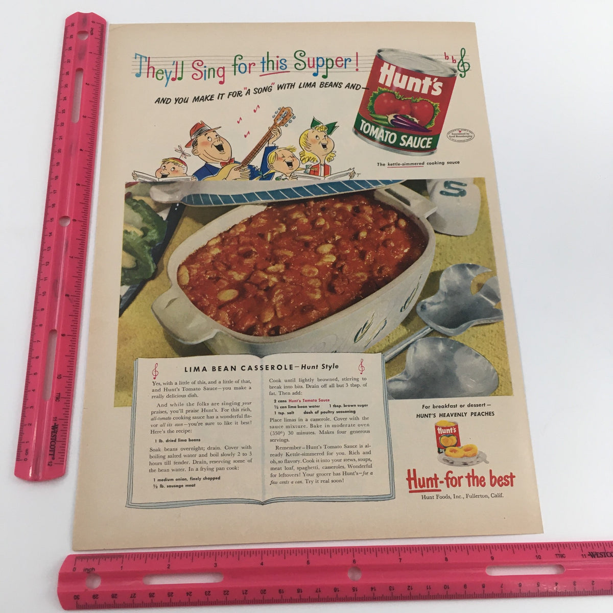 Detailed view of the 1950 Hunt's Tomato Sauce Lima Bean Casserole Recipe Vintage Print Ad featuring a casserole and lively illustrations, highlighting the recipe for kids featuring Lima Beans.