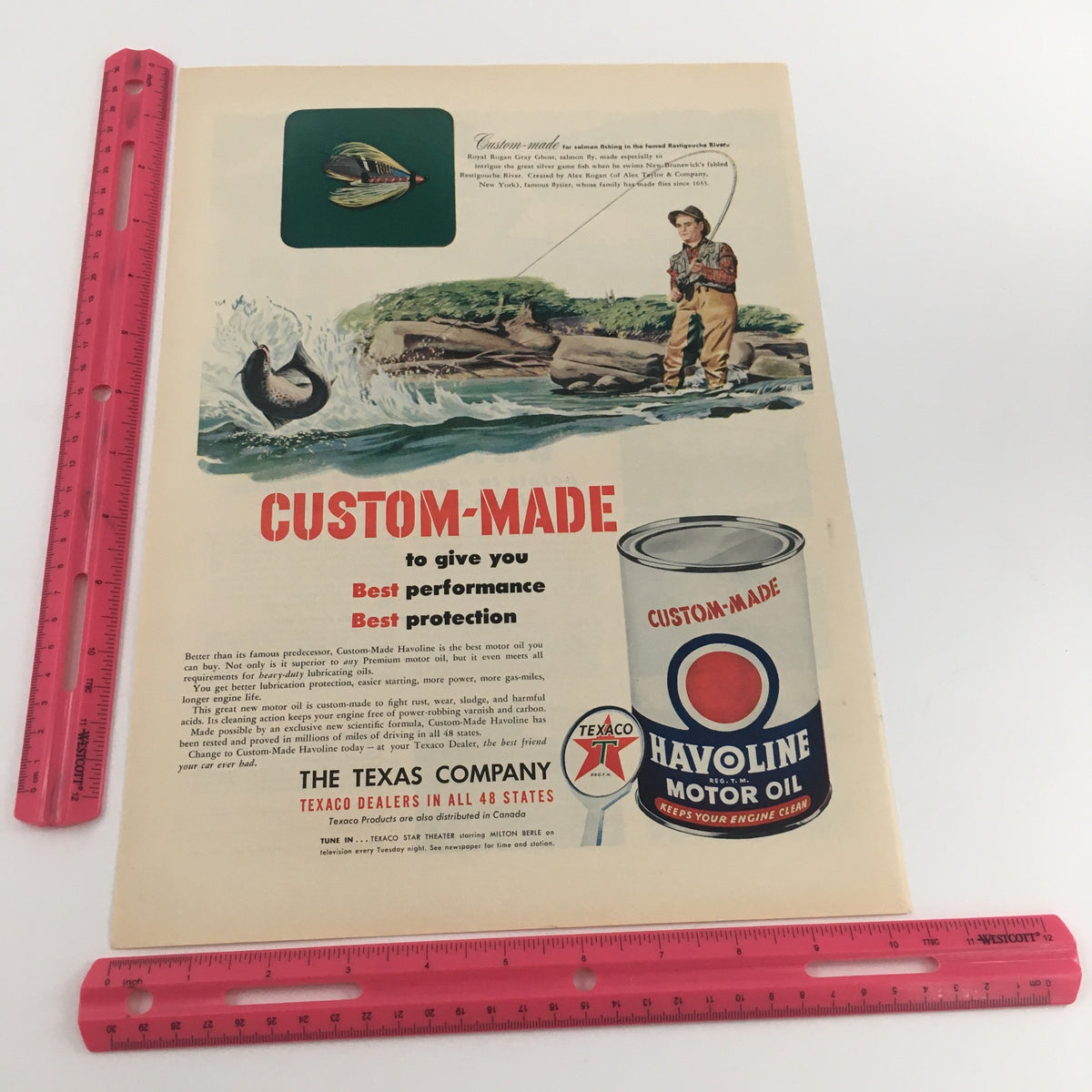 Custom-made Havoline Motor Oil advertisement featuring a fisherman and scenic landscape. 1950 Custom-Made Havoline Motor Oil Texas Company.