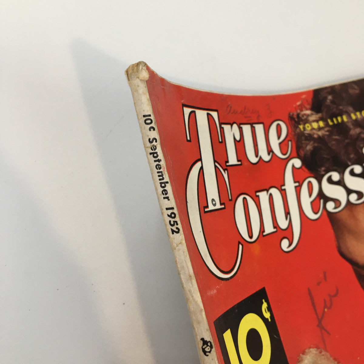Side view of the cover of True Confessions Magazine September 1952, revealing its vintage price and date, representing mid-century American culture and collectible value.